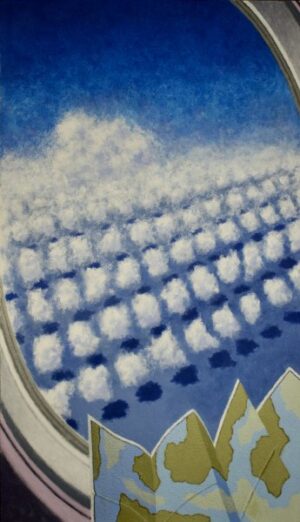 View of clouds from an airplane window, with a partial map in the foreground.